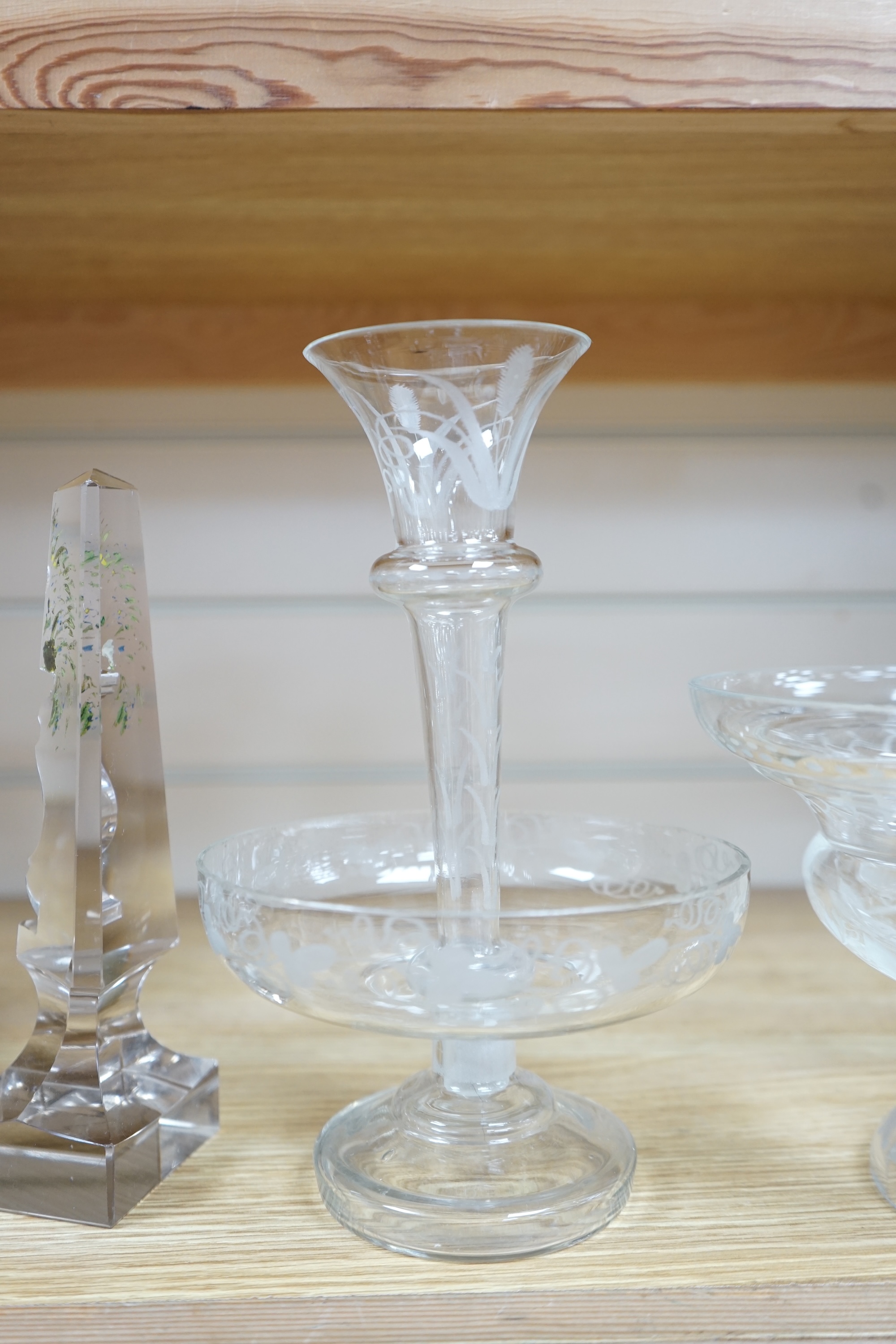 Victorian and later glassware comprising a pair of glass obelisks, an epergne and a similar glass pedestal dish, epergne 24cm high. Condition - obelisk painting worn, all good condition